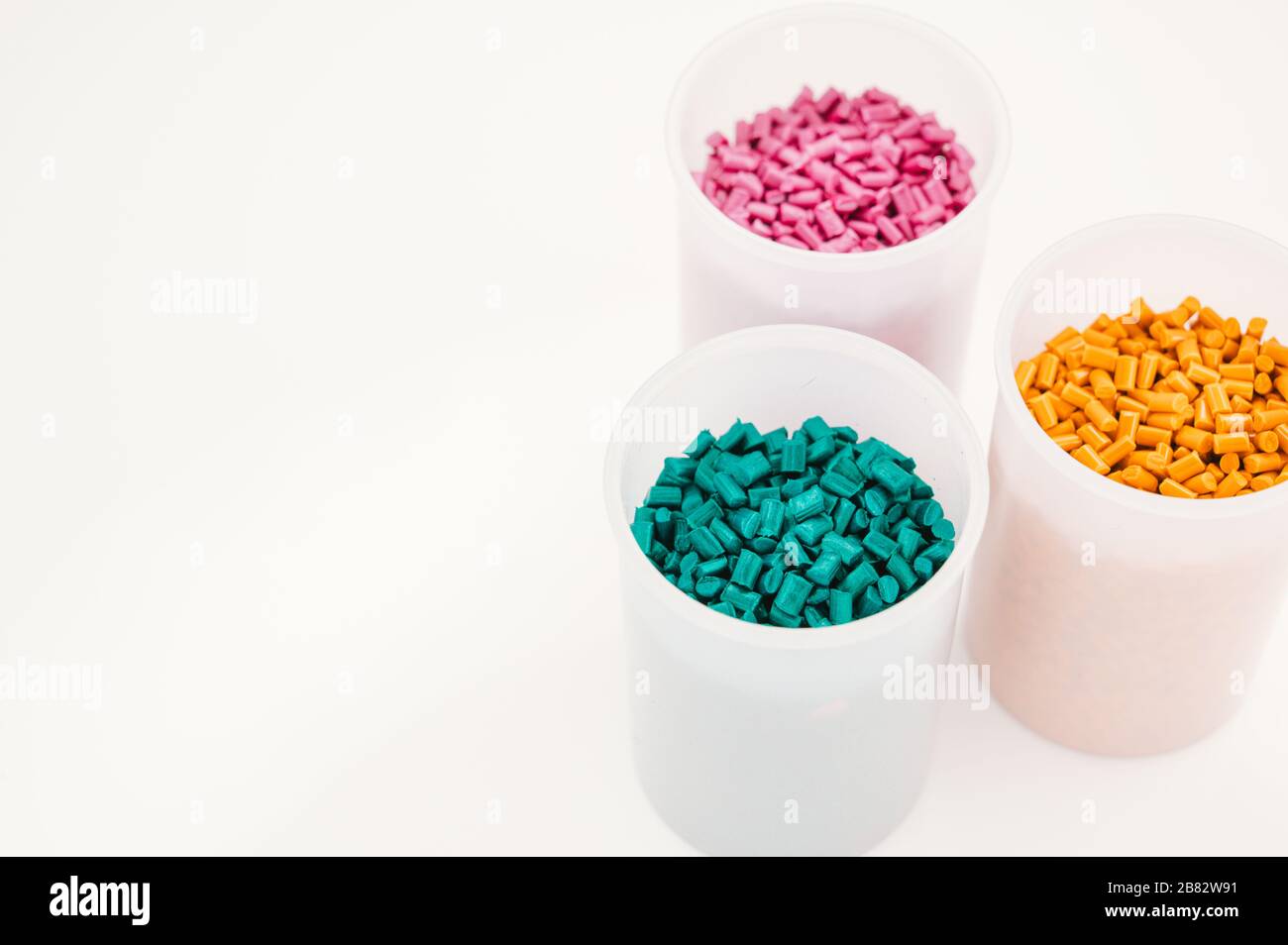 Plastic granules close up for holding,Colorful plastic granules with white background. and dollar money,Plastic Business,Plastic industry. Stock Photo