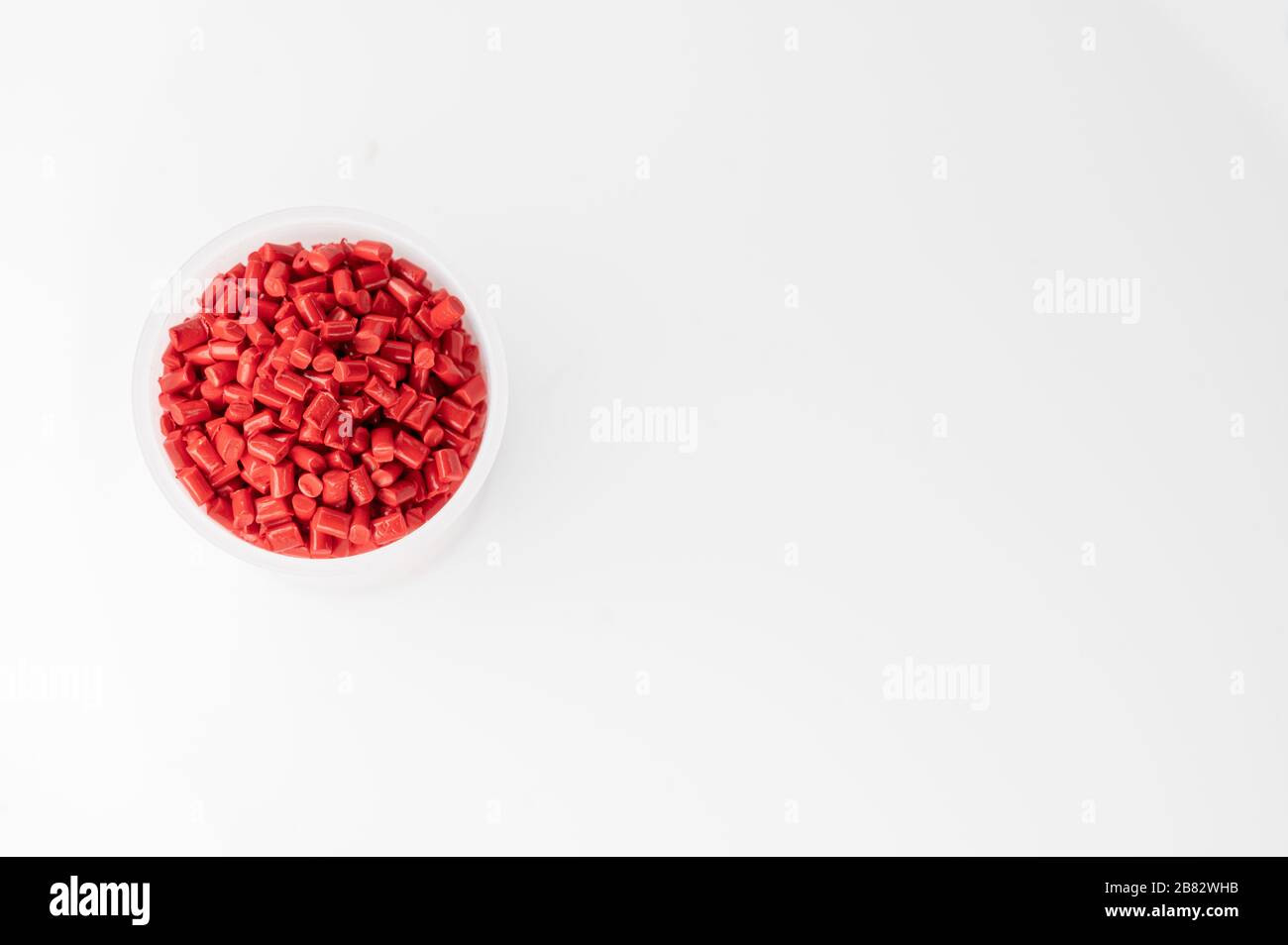 Plastic granules close up for holding,Colorful plastic granules with white background. and dollar money,Plastic Business,Plastic industry. Stock Photo