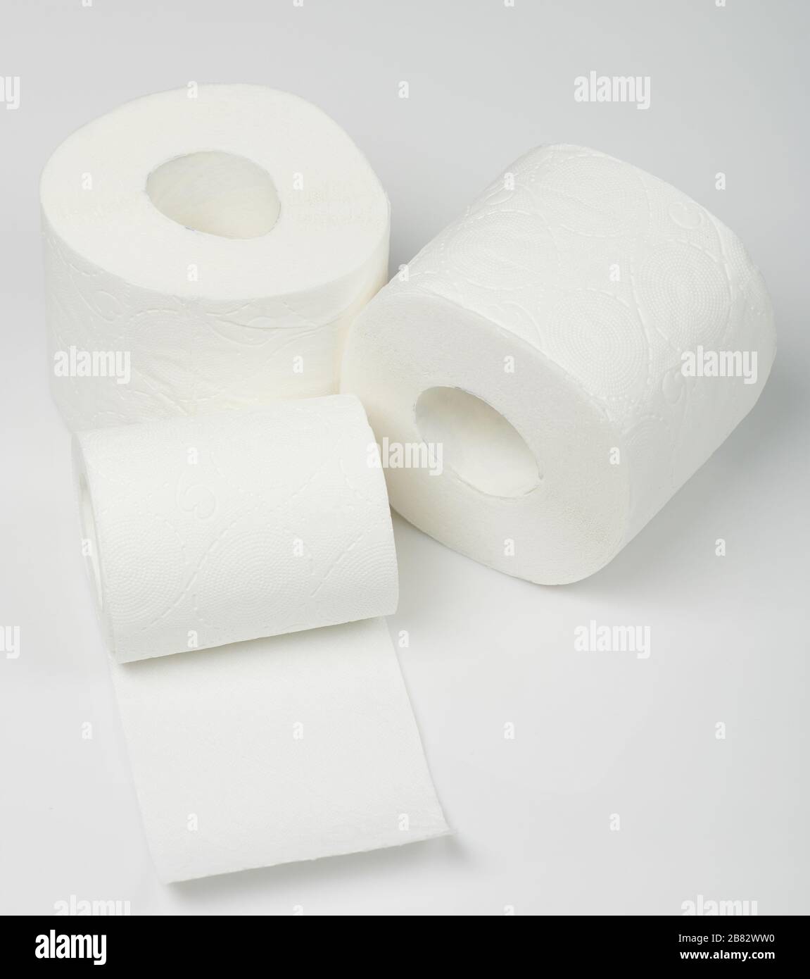 Three rolls of toilet paper isolated on white studio background Stock Photo