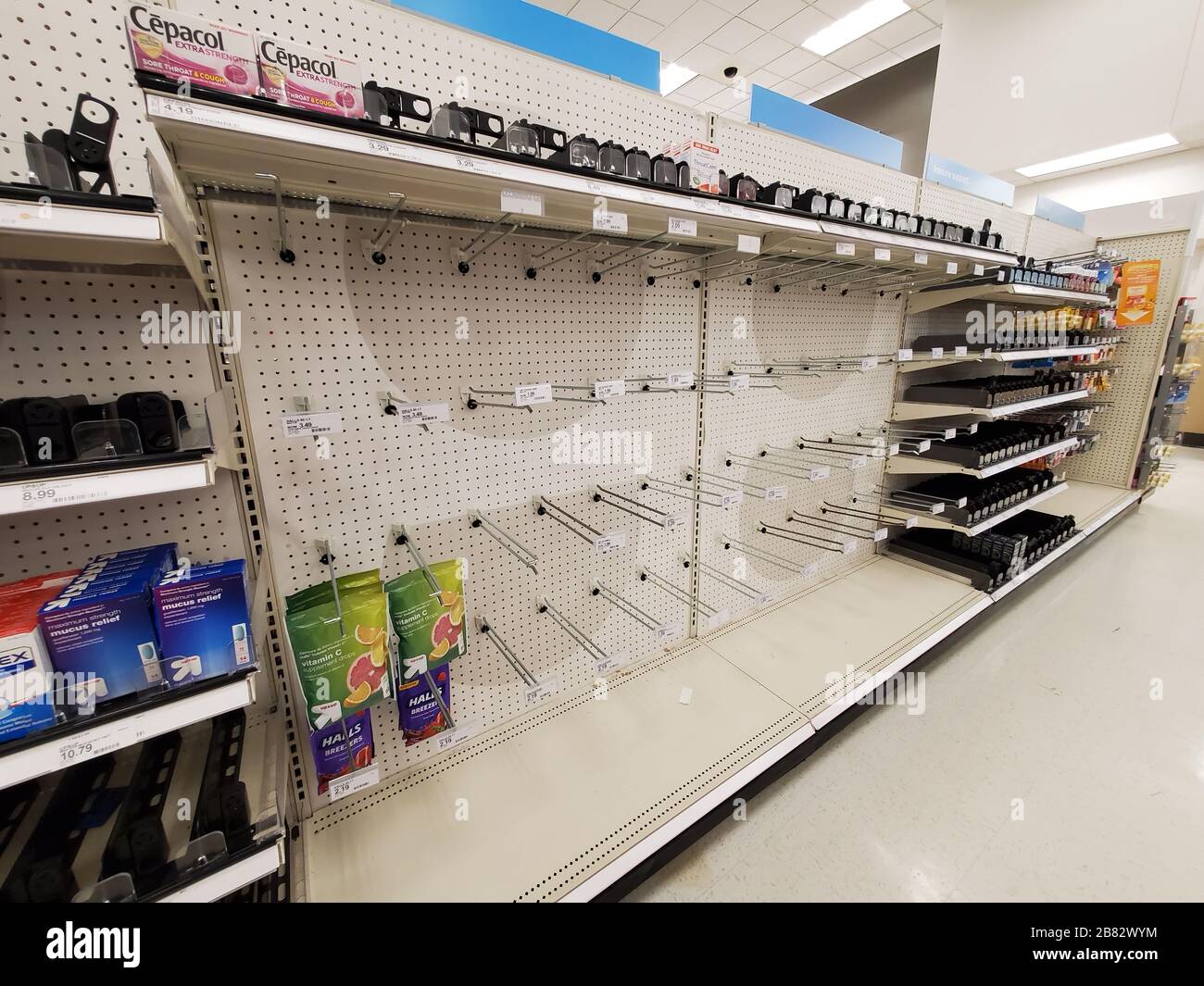 During an outbreak of the COVID-19 coronavirus, customers purchased all available toilet paper, paper towels, medical supplies, hand sanitizer and other essential items, leaving empty shelves at a Target retail store in Contra Costa County, San Ramon, California, a region where the virus was confirmed to be actively spreading, March 12, 2020. () Stock Photo