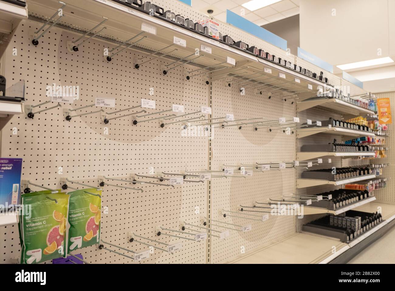 Empty shelves are visible at a Target retail store in Contra Costa County, San Ramon, California, as residents purchase all available stock of toilet paper, paper towels, canned goods, hand sanitizer and other essential items during an outbreak of the COVID-19 coronavirus, March 12, 2020. () Stock Photo