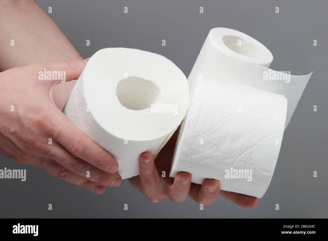 Pile of toilet paper in hand cllose up view Stock Photo