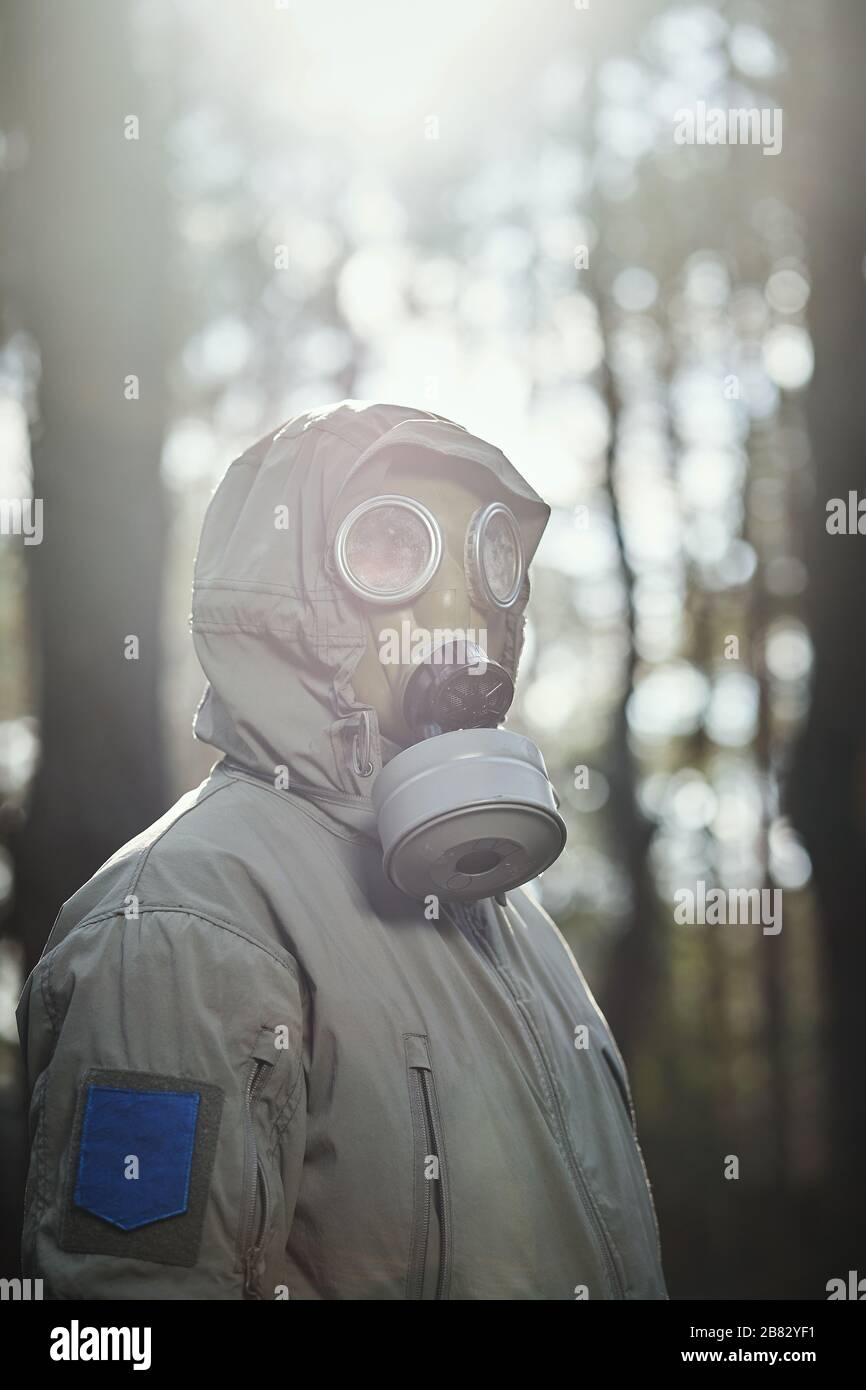 man in a gas mask protects himself from coronavirus Stock Photo