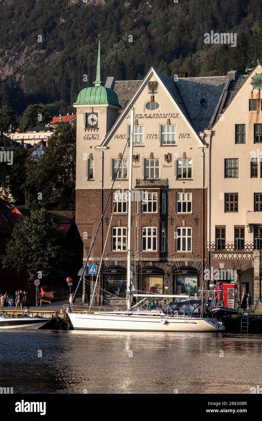 Sailboat SeaDream alongside Bryggen historic quay, in prt of Bergen, Norway. Kjøbmandsstuen, Bryggen 15. Stock Photo