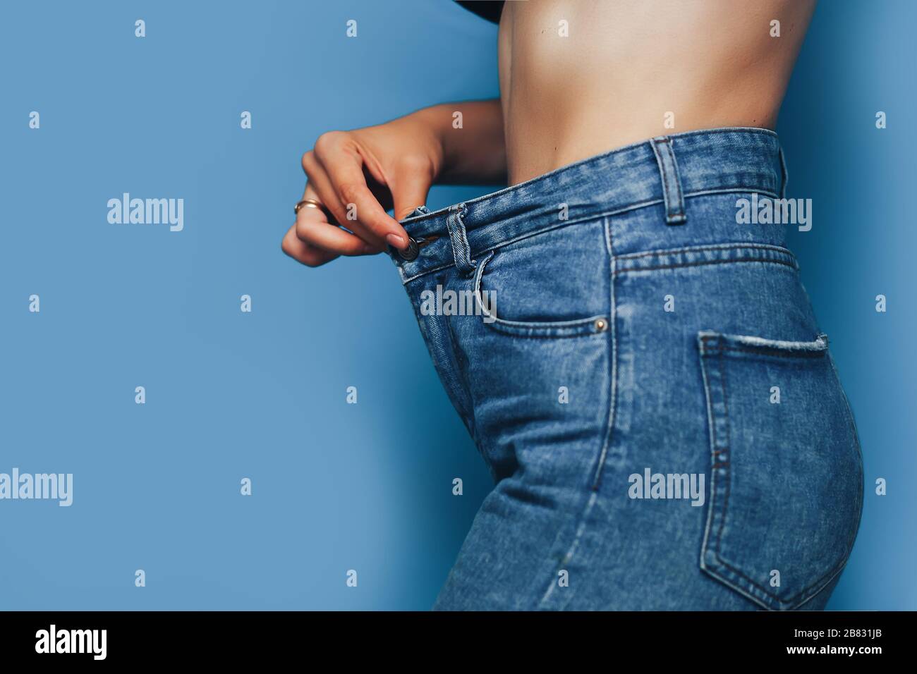 skinny woman body with Loose pants jeans, Light weight body with loose  clothes, slender and Healthy body low fat concept Stock Photo - Alamy