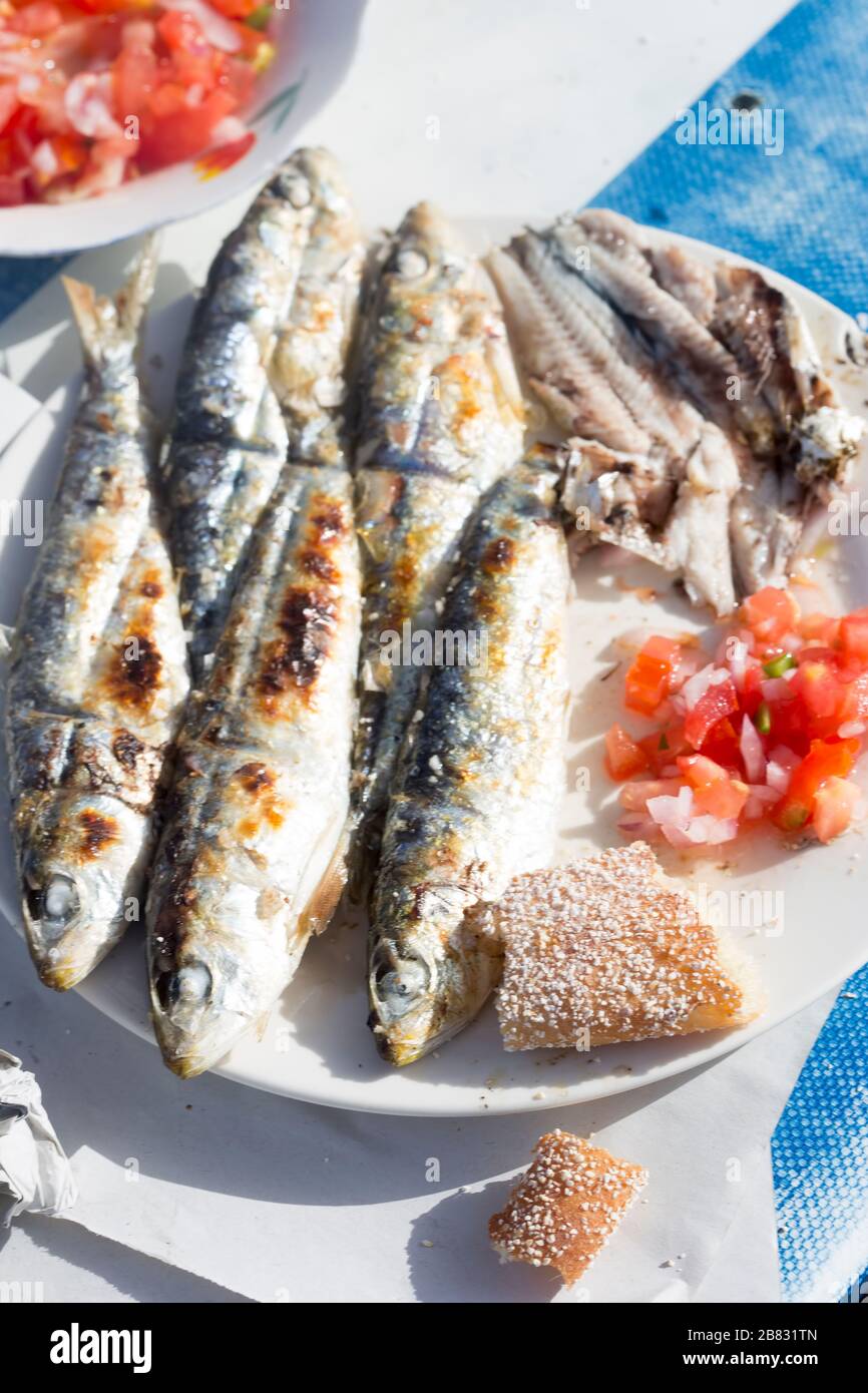 Grilled sardines with moroccan tomato salad Stock Photo Alamy