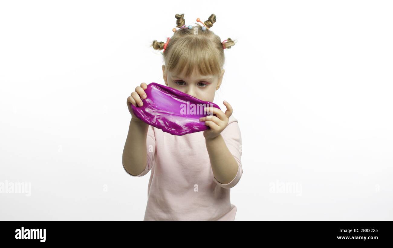Child Having Fun Making Purple Slime Kid Playing With Hand Made Toy Slime Funny Kid Girl