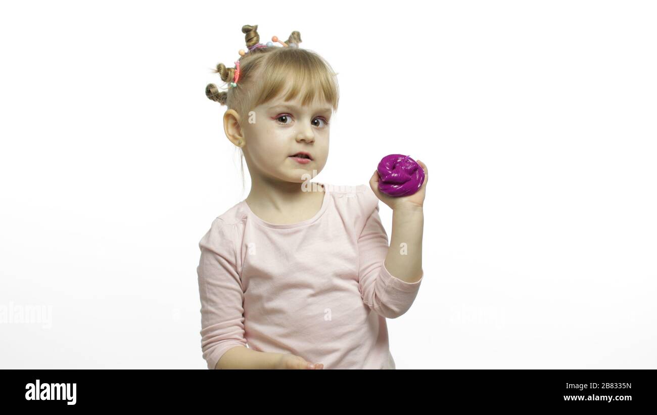 Child Having Fun Making Purple Slime Kid Playing With Hand Made Toy Slime Funny Kid Girl