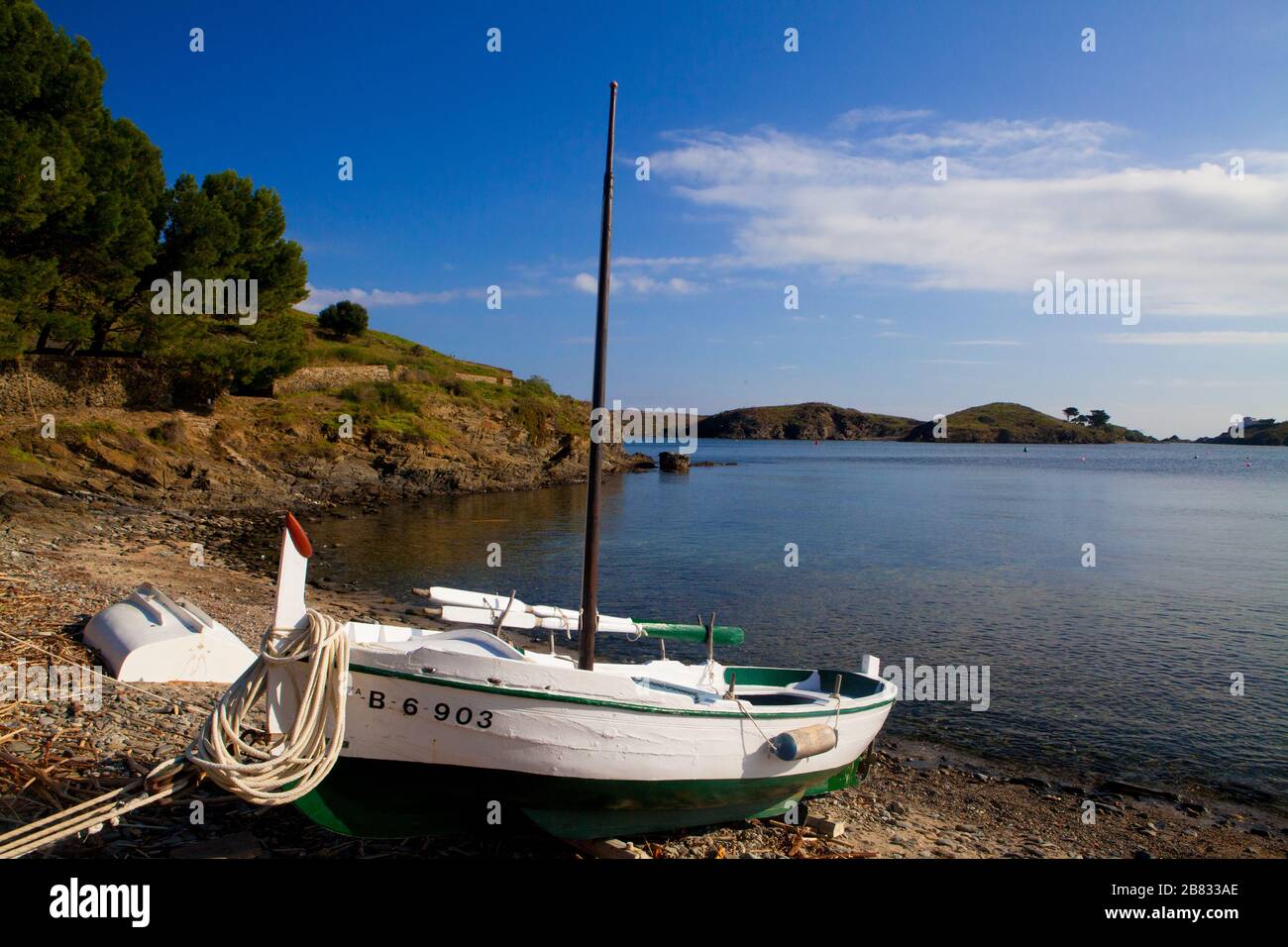 Some boats standing on the shore of Port Lligat village in Costa Brava, Girona, Spain. Stock Photo