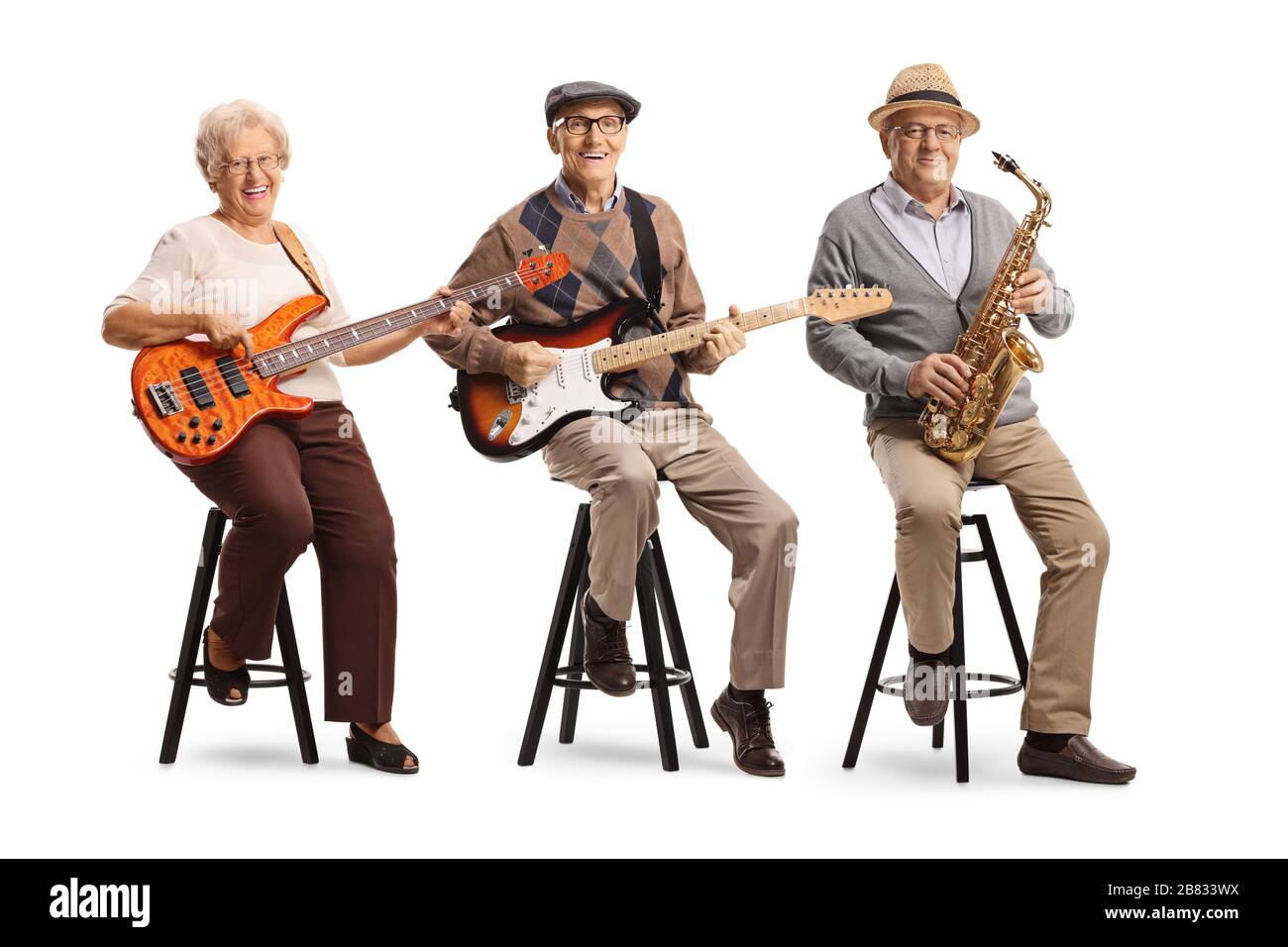 Elderly people sitting and playing musical instruments isolated on white background Stock Photo