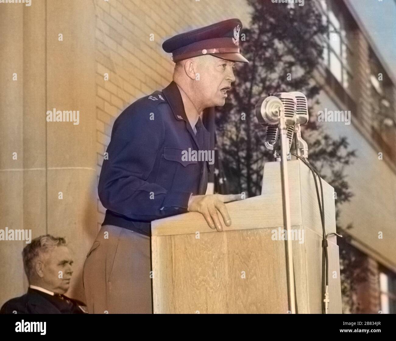 General Dwight D. Eisenhower holding a speech at the Aircraft Engine Research Laboratory, Cleveland, Ohio, Center Director Edward Ray Sharp sitting in the background, April 11, 1946. Image courtesy National Aeronautics and Space Administration (NASA). Note: Image has been digitally colorized using a modern process. Colors may not be period-accurate. () Stock Photo