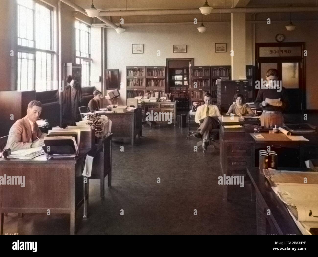 NACA personnel working in the Langley administrative office, Langley  Research Center, Hampton, Virginia, 1927. Image courtesy National  Aeronautics and Space Administration (NASA). Note: Image has been digitally  colorized using a modern process.