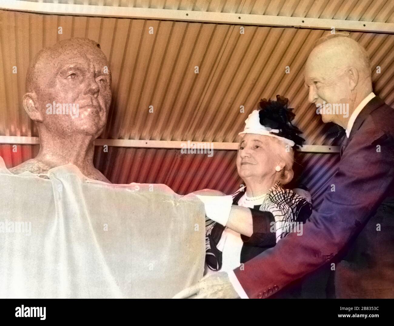 President Dwight D. Eisenhower and Mrs. Lily Coles Marshall unveiling the bronze bust of General George C. Marshall during the dedication ceremony of the Marshall Space Flight Center (MSFC) in Huntsville, Alabama, October 21, 1960. Image courtesy National Aeronautics and Space Administration (NASA). Note: Image has been digitally colorized using a modern process. Colors may not be period-accurate. () Stock Photo