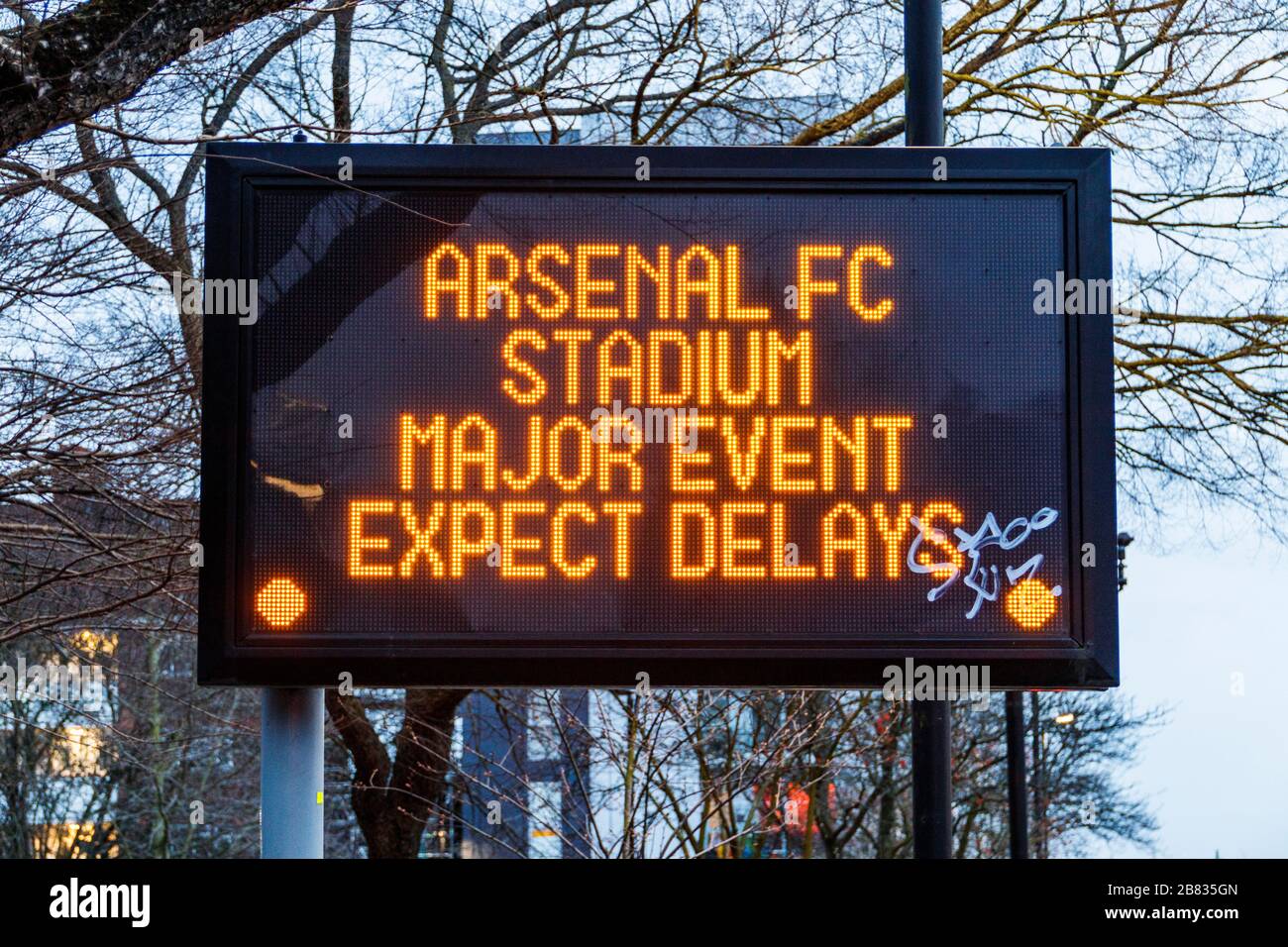Illuminated dot matrix display warning of delays due to Arsenal FC event, Archway Road, London, UK Stock Photo