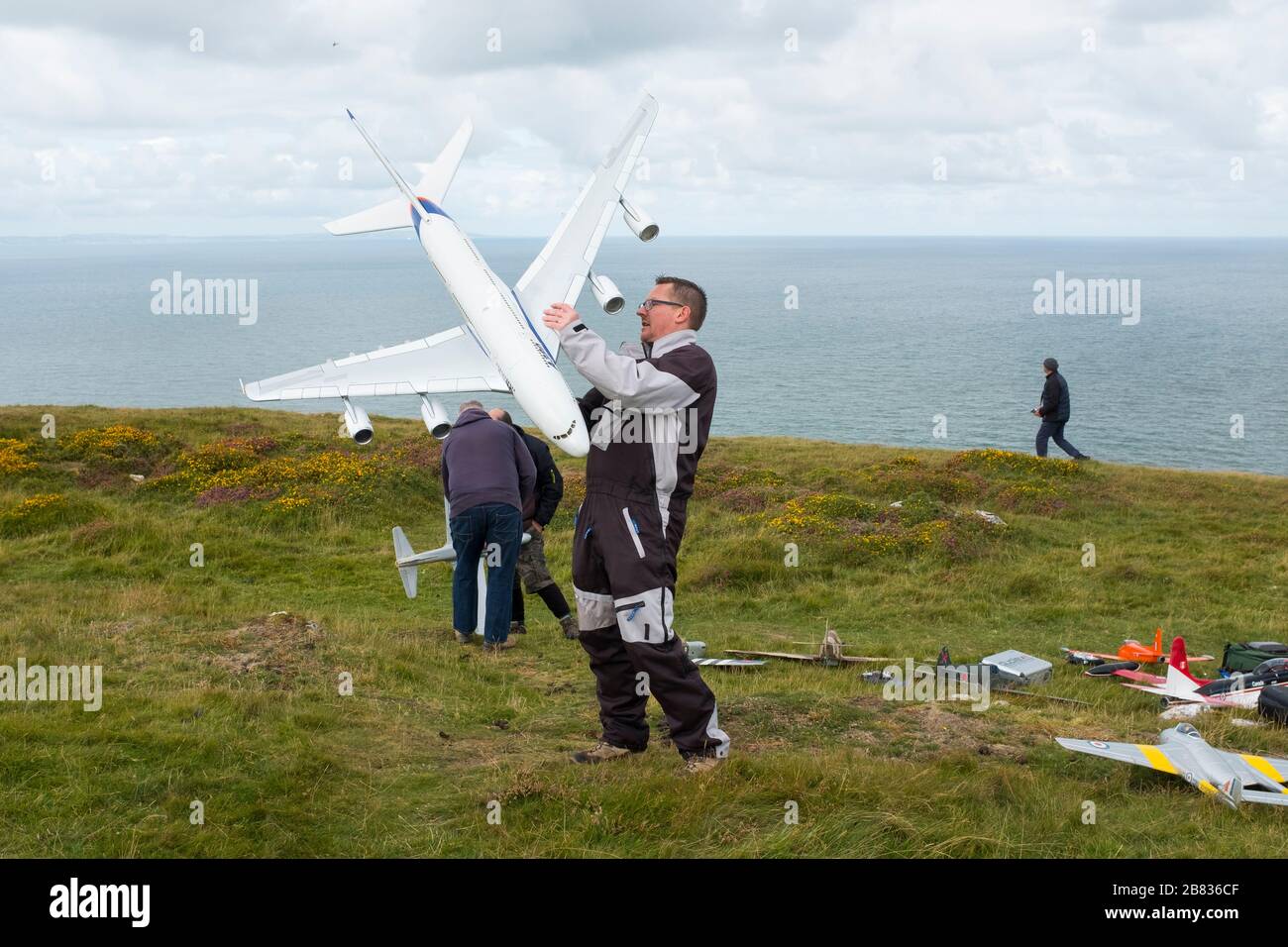 Model aircraft enthusiasts with gliders on the Great Orme at Llandudno, Wales, UK Stock Photo