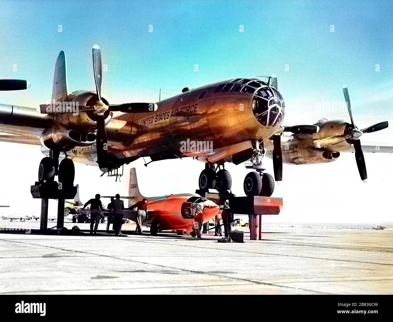 X-1 'Queenie' aircraft mated to the EB-50A 'Superfortress' aircraft at Edwards Air Force Base, Kern County, California, November 9, 1951. Image courtesy National Aeronautics and Space Administration (NASA). Note: Image has been digitally colorized using a modern process. Colors may not be period-accurate. () Stock Photo