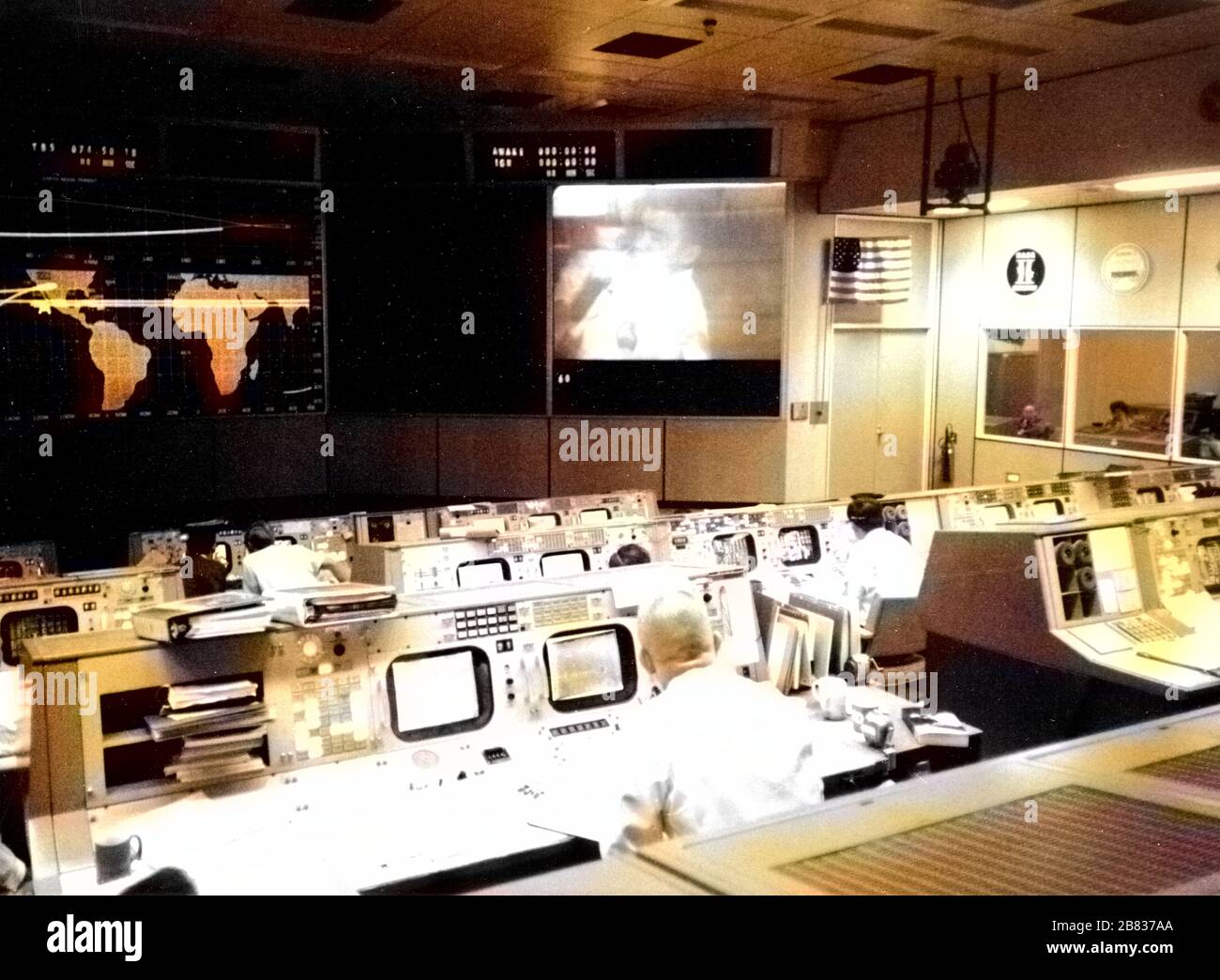 Photograph of the Apollo 13 Mission Operations Control Room in the Mission Control Center at the Manned Spacecraft Center, Huston, Texas, Eugene F. Kranz and Fred W. Haise Jr, 1970. Image courtesy National Aeronautics and Space Administration (NASA). Note: Image has been digitally colorized using a modern process. Colors may not be period-accurate. () Stock Photo