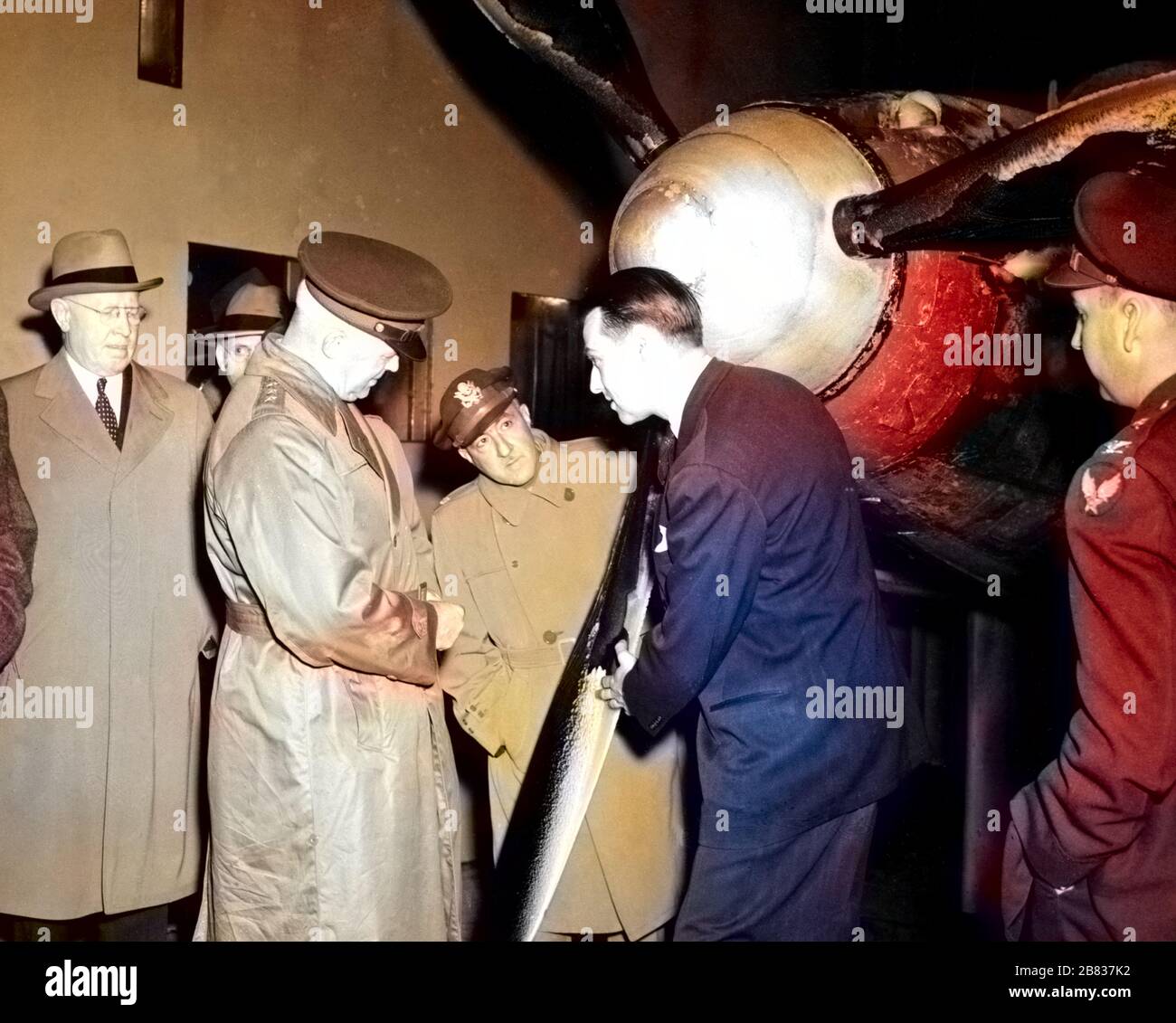 Henry Harley 'Hap' Arnold inspecting ice formation on propeller blades at the Aircraft Engine Research Laboratory in Cleveland, Ohio, November 9, 1944. Image courtesy National Aeronautics and Space Administration (NASA). Note: Image has been digitally colorized using a modern process. Colors may not be period-accurate. () Stock Photo