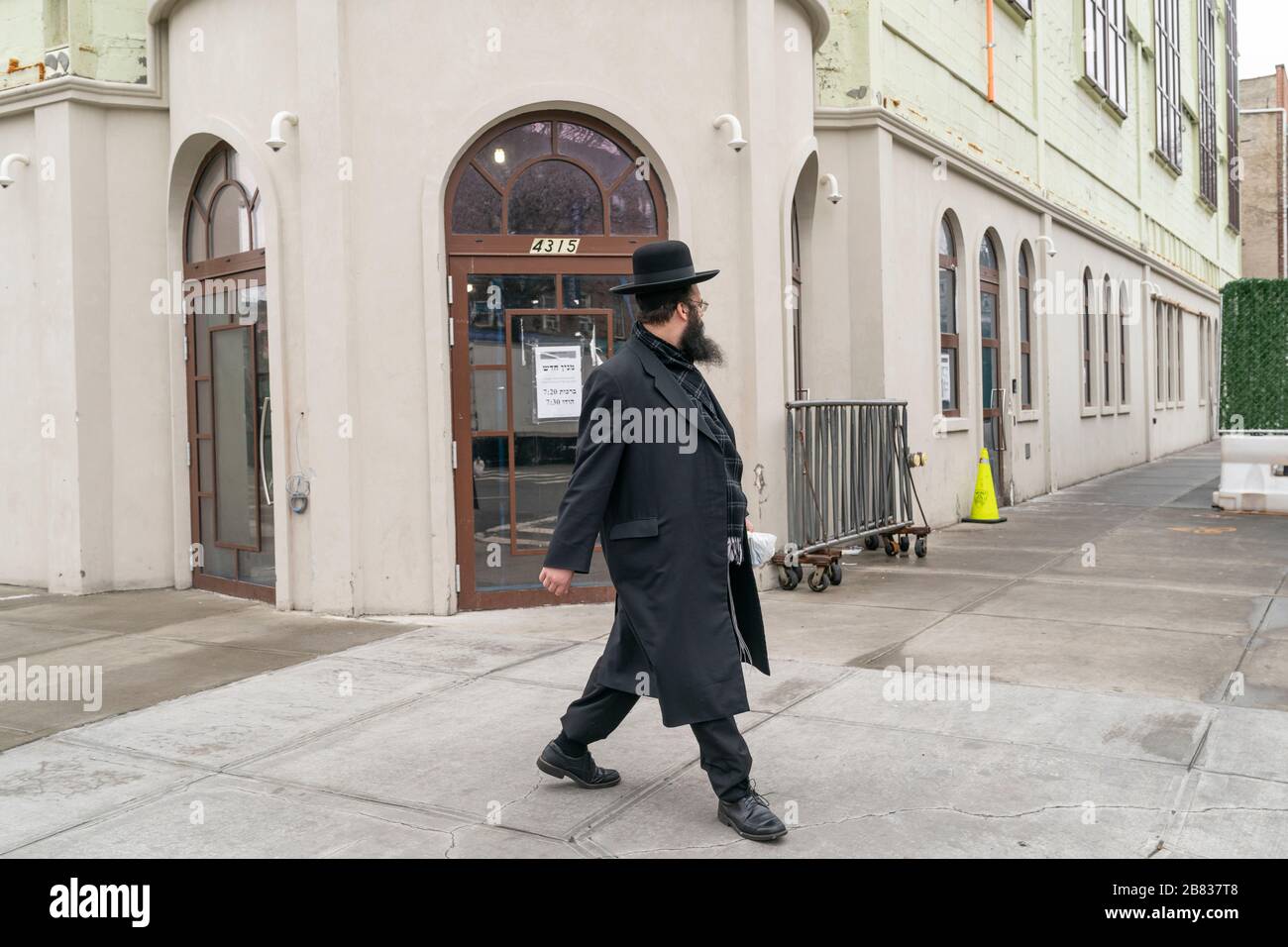 New York, NY March 19, 2020 Hasidic Jewish man passes private
