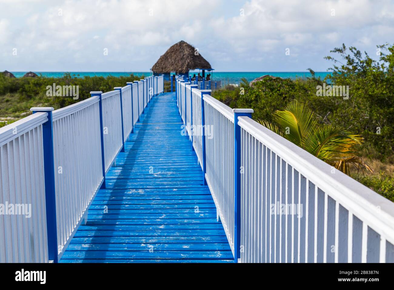 Looking down an elevated wooden walkway to Playa Pilar, one of the most beautiful beaches in Cuba. Stock Photo