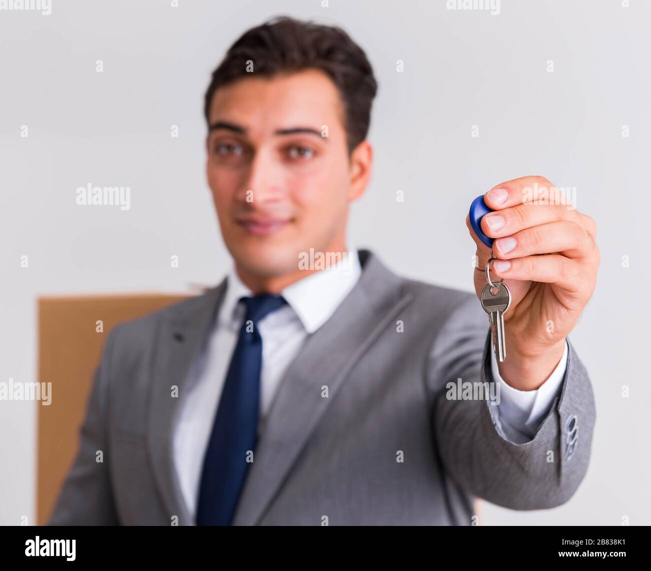 The real estate agent with key from new house Stock Photo Alamy