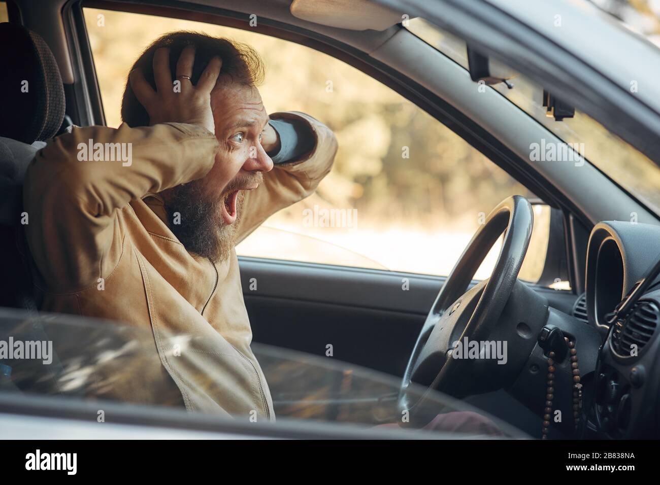 Crazy Angry Man Annoyed While Driving a Car. Mad Agrressive Driver
