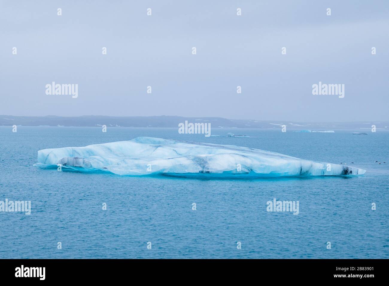 Lonesome Iceberg in the Jökulsárlón Lagoon in Southeast Iceland. Stock Photo