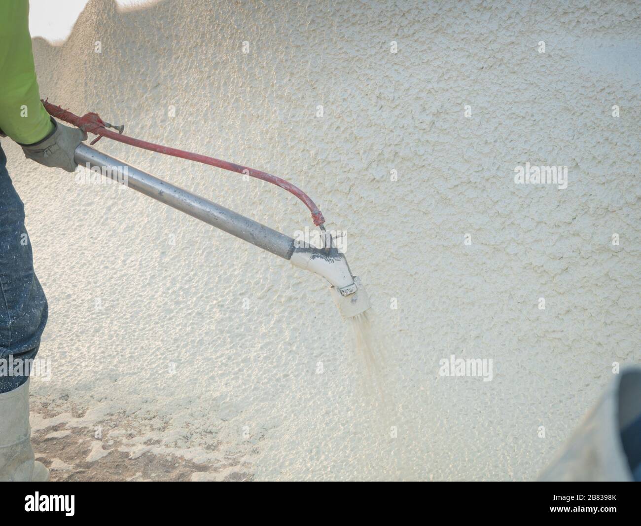 Man spraying cement during a swimming pool renovation Stock Photo Alamy