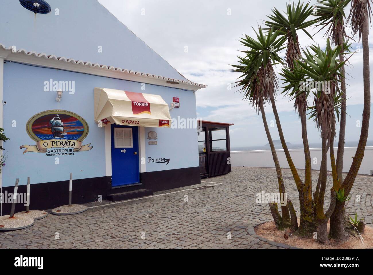 A pub overlooking the ocean in Angra do Heroísmo on the island of Terceira in the Azores archipelago. Stock Photo