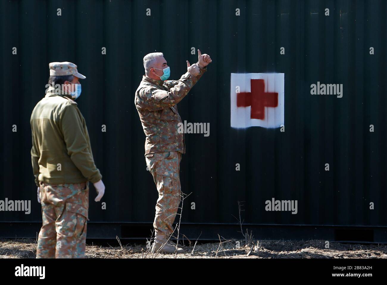 Bucharest, Romania. 19th Mar, 2020. Romanian soldiers set up a military hospital for possible victims of COVID-19 epidemic in Otopeni, near Bucharest, Romania, March 19, 2020. Romania entered an emergency state starting on March 16, in an effort to ensure that the government uses all resources to fight the COVID-19 epidemic. Credit: Cristian Cristel/Xinhua/Alamy Live News Stock Photo