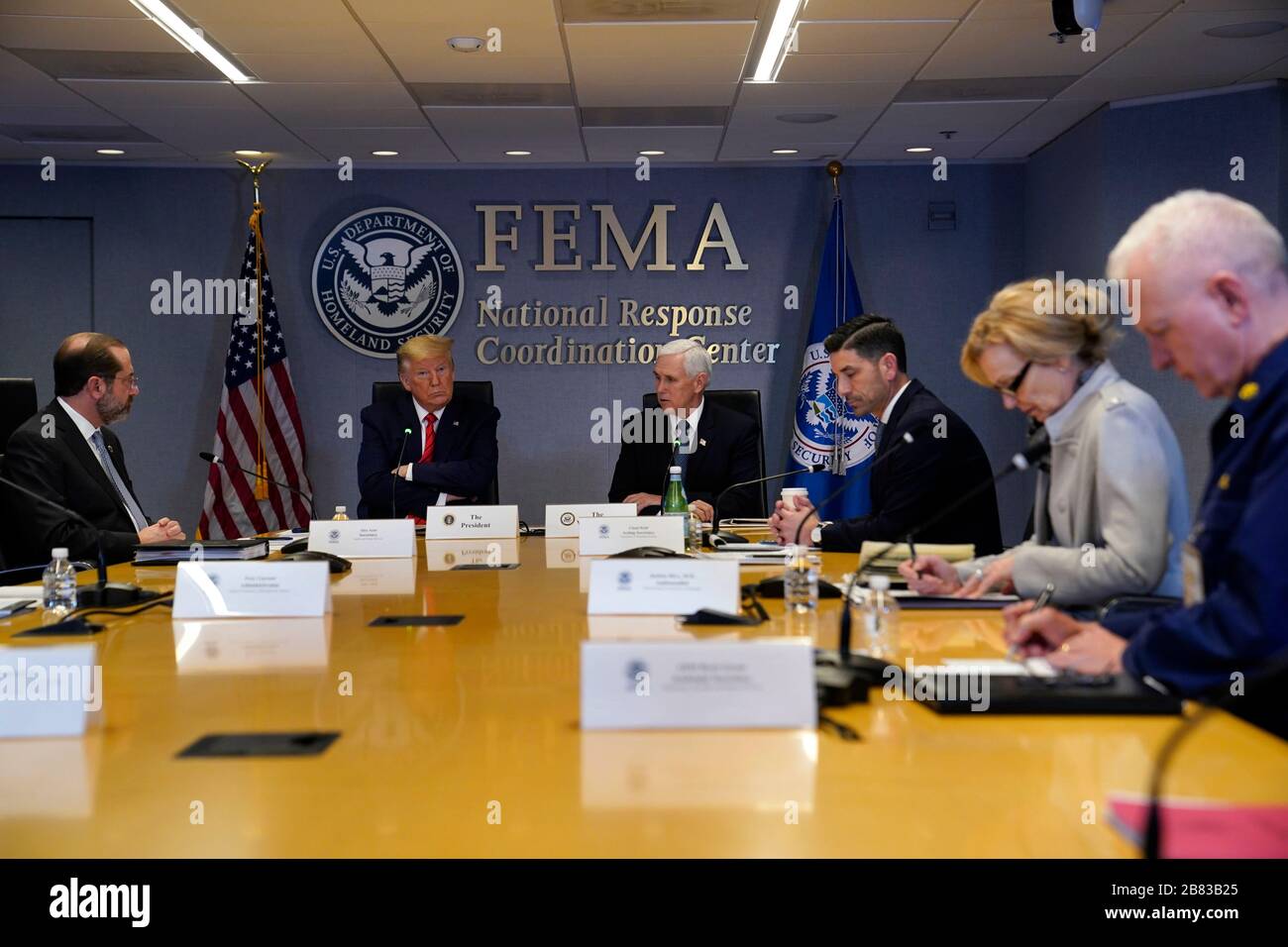 Washington DC, USA. 19th Mar, 2020. United States President Donald J. Trump attends a teleconference with governors at the Federal Emergency Management Agency headquarters, Thursday, March 19, 2020, in Washington, DC. From left, US Secretary of Health and Human Services (HHS) Alex Azar, President Trump, US Vice President Mike Pence, acting US Secretary of Homeland Security Chad Wolf, Dr. Deborah L. Birx, White House Coronavirus Response Coordinator, and Admiral Brett Giroir, US Assistant Secretary for Health. Credit: MediaPunch Inc/Alamy Live News Stock Photo