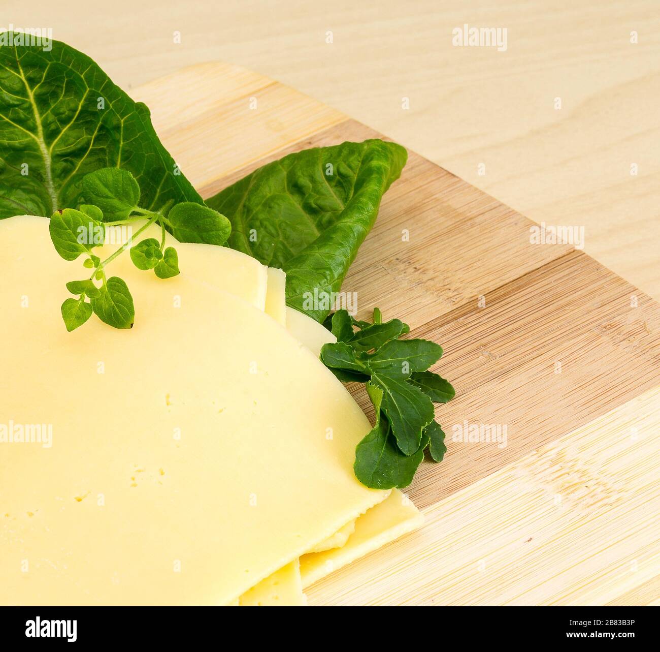Thin sliced continental cheese with salad garnish Stock Photo Alamy