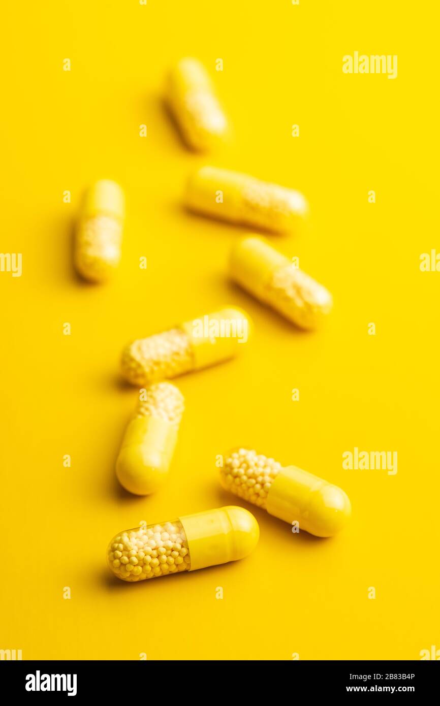 Vitamin capsules. Vitamin C pills on yellow background Stock Photo Alamy