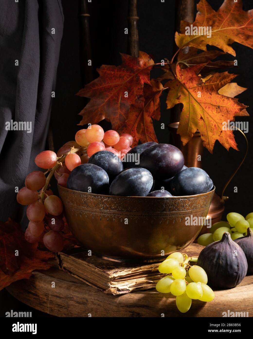 Still life with autumn fruits - dark food photography Stock Photo - Alamy