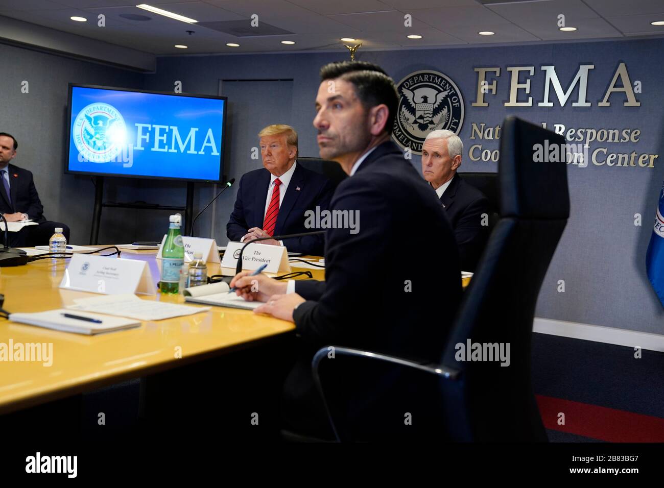 Washington DC, USA. 19th Mar, 2020. United States President Donald J. Trump and US Vice President Mike Pence listen during a teleconference with governors at the Federal Emergency Management Agency headquarters, Thursday, March 19, 2020, in Washington DC, USA. Acting Secretary of Homeland Security Chad Wolf, is second from right. Credit: Evan Vucci/Pool via CNP | usage worldwide Credit: dpa/Alamy Live News Stock Photo