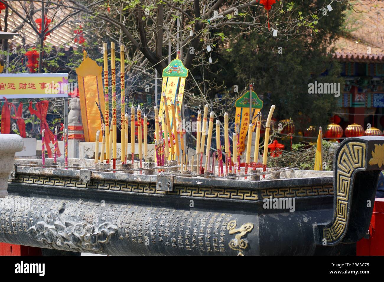 Burning incense at the Jade Buddha Palace. The Mahavira Palace, Anshan, Liaoning Province, China, Asia. Stock Photo