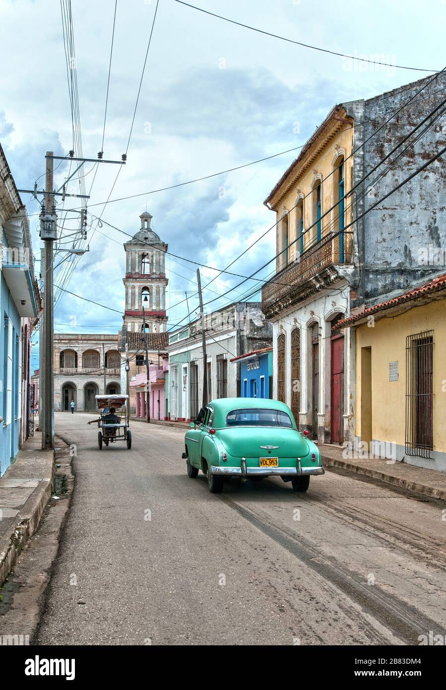 Vintage car and Iglesia Parroquial Mayor(Major Parochial) church, Remedios, Santa Clara, Cuba Stock Photo