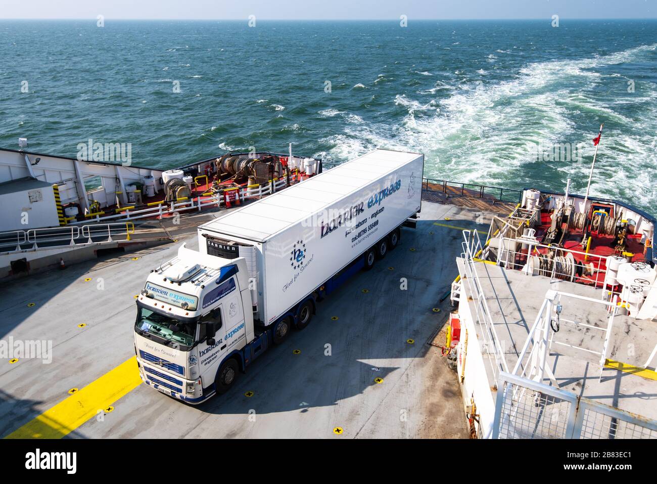 Lorry on the back of a ferry travelling from Dover to Dunkerque. Stock Photo