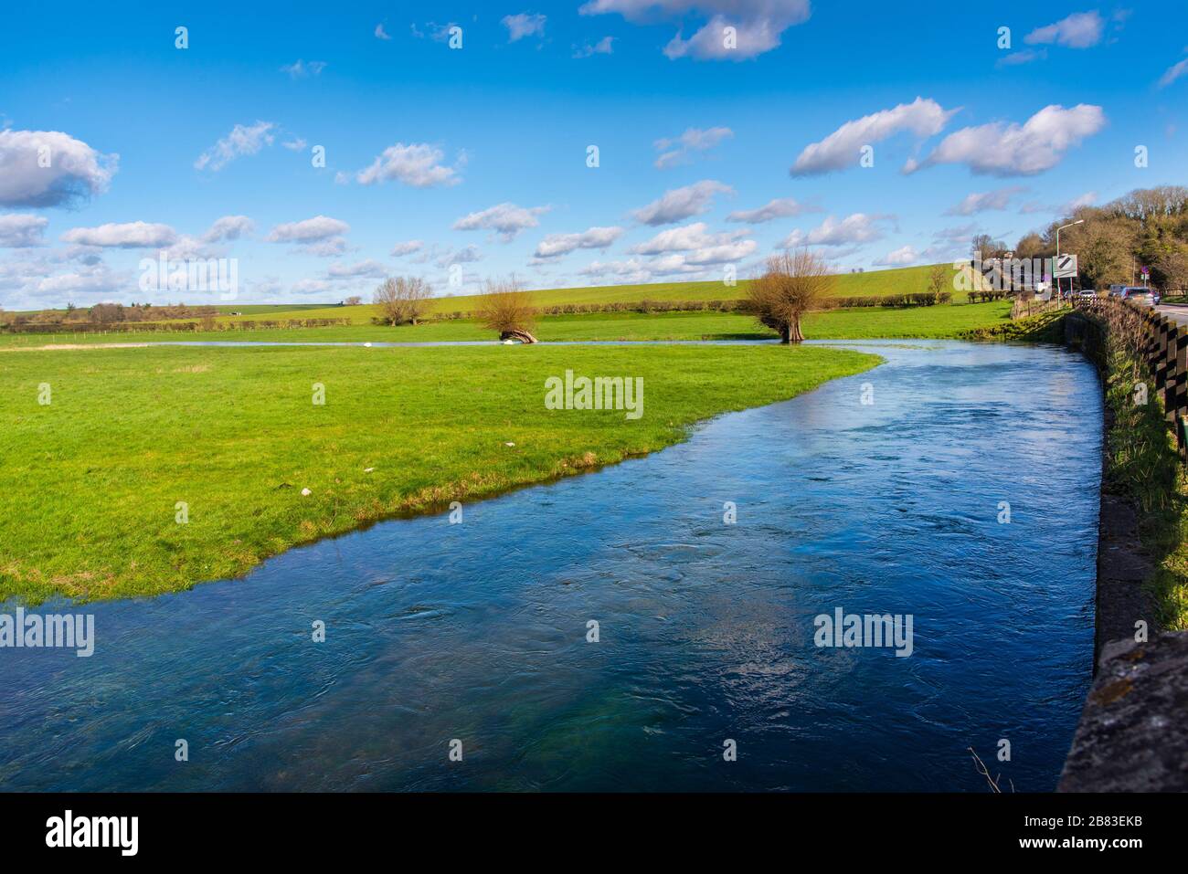 The River Till in flood at Winterbourne Stoke, Wiltshire, UK. A winterbourne is a stream that flows in winter, but is often dry in summer. Stock Photo