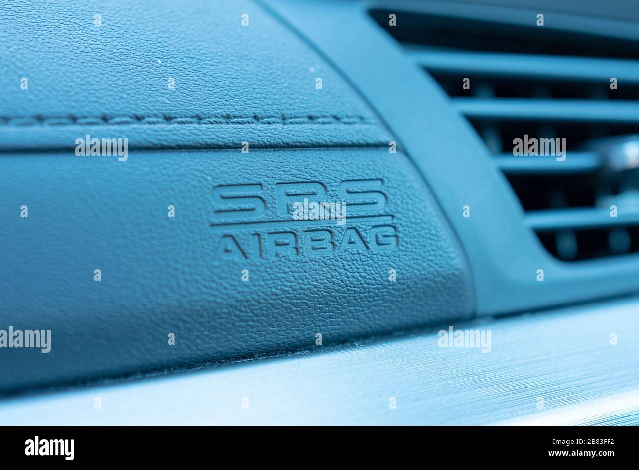 Close-up of logo indicating presence of Supplemental Restraint System (SRS) airbag on dashboard of a car in Lafayette, California, February 7, 2020. () Stock Photo