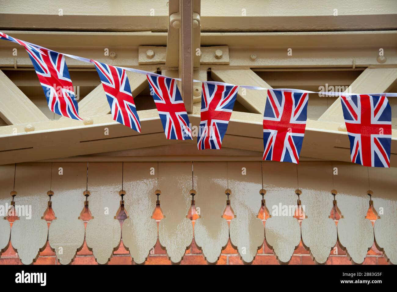 Union Jack flags decorating Loughborough station on the Great Central Railway, Loughborough, Leicestershire, England, Stock Photo