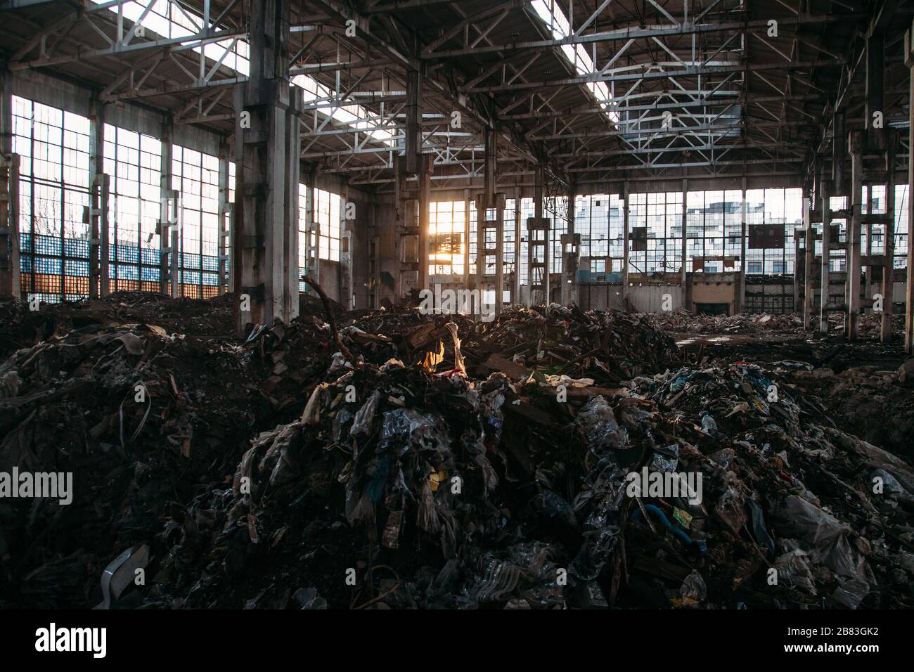 Abandoned large industrial hall with garbage. Voronezh excavator manufacturing factory Stock Photo