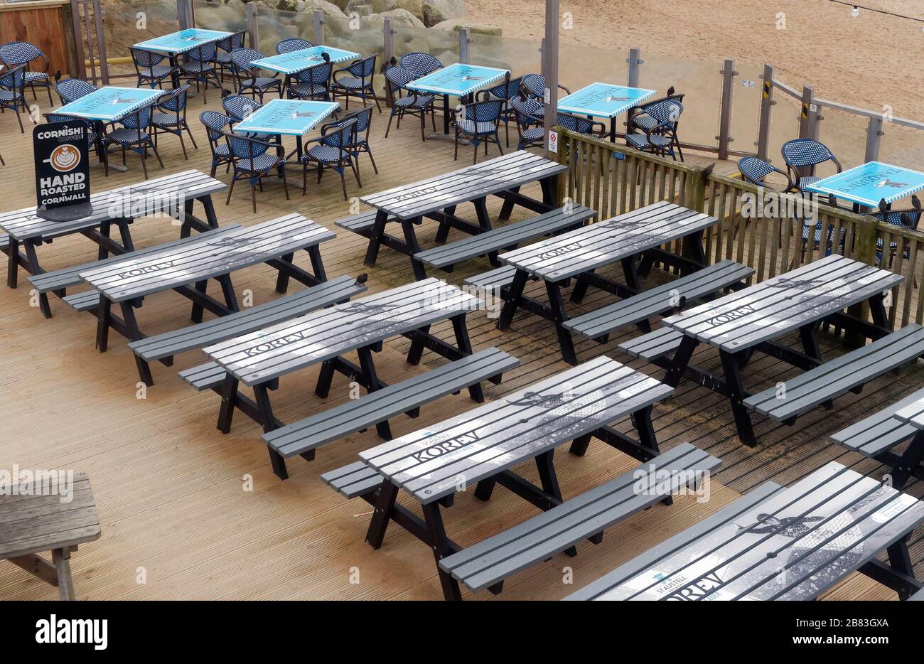 UK Weather, 19th March 2020. UK Fistral beach Newquay Cornwall. bars cafes and amusement arcades left deserted as public heed advice to stay away. Cre Stock Photo