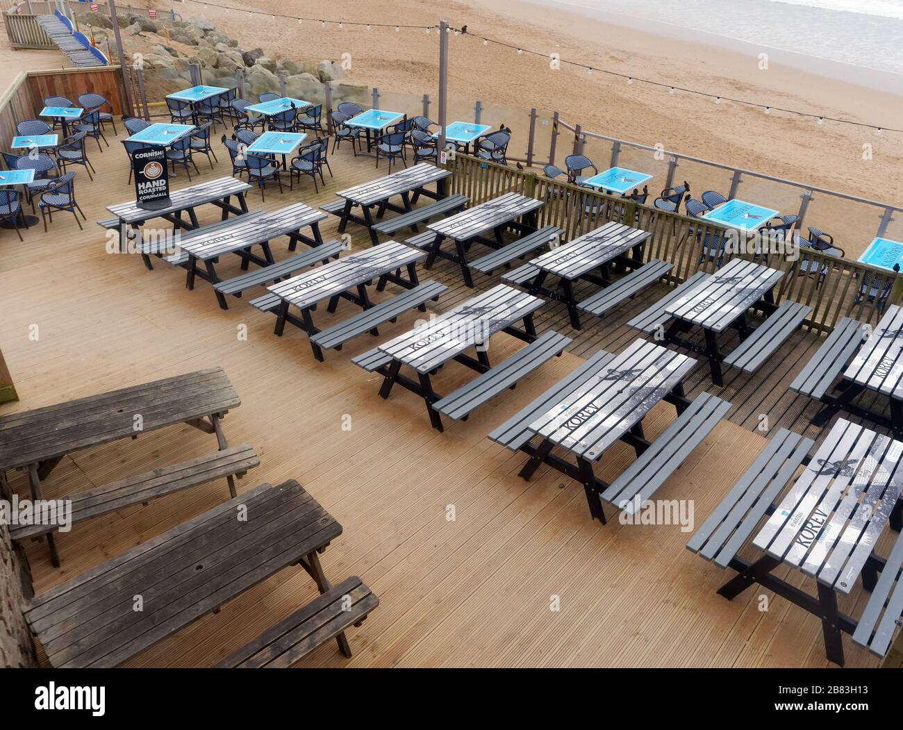 UK Weather, 19th March 2020. UK Fistral beach Newquay Cornwall. bars cafes and amusement arcades left deserted as public heed advice to stay away. Cre Stock Photo