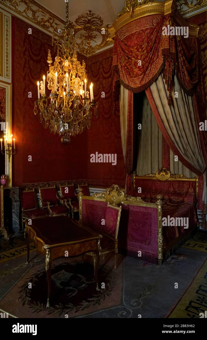 Red bedroom inside Chateau de Fontainebleau.Fontainebleau.Seine-et-Marne.France Stock Photo