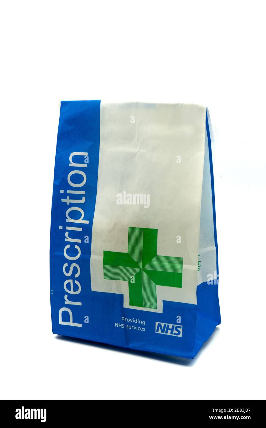 A British NHS prescription paper bag isolated on a white background Stock Photo
