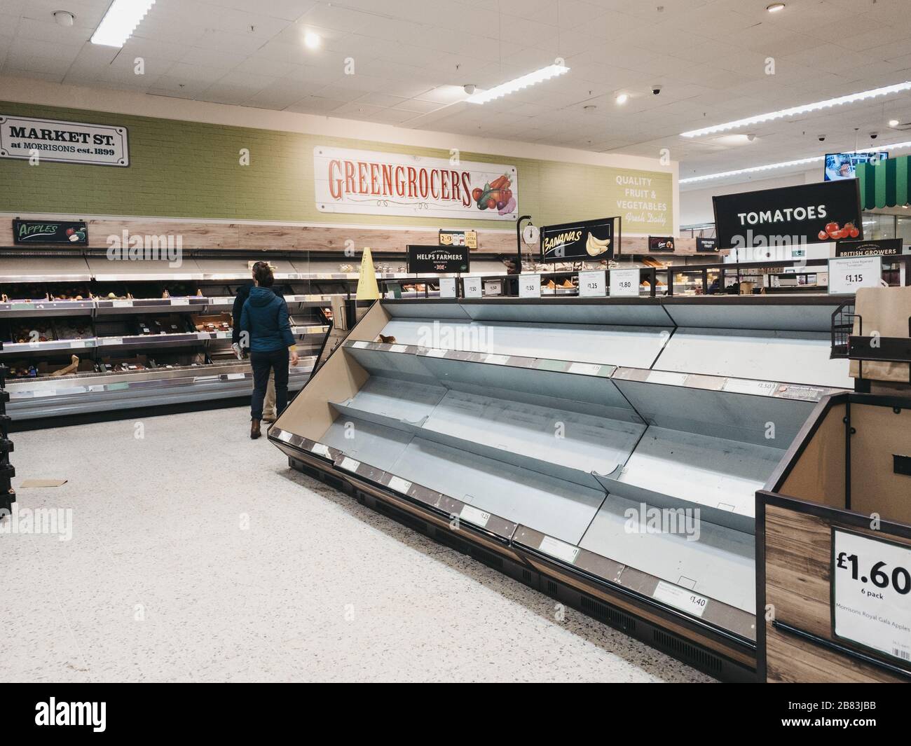 Empty shelves in fruit and vegetables aisle of Morrisons supermarket in Palmers Green, London, as people stock up due to Coronavirus threat. Stock Photo