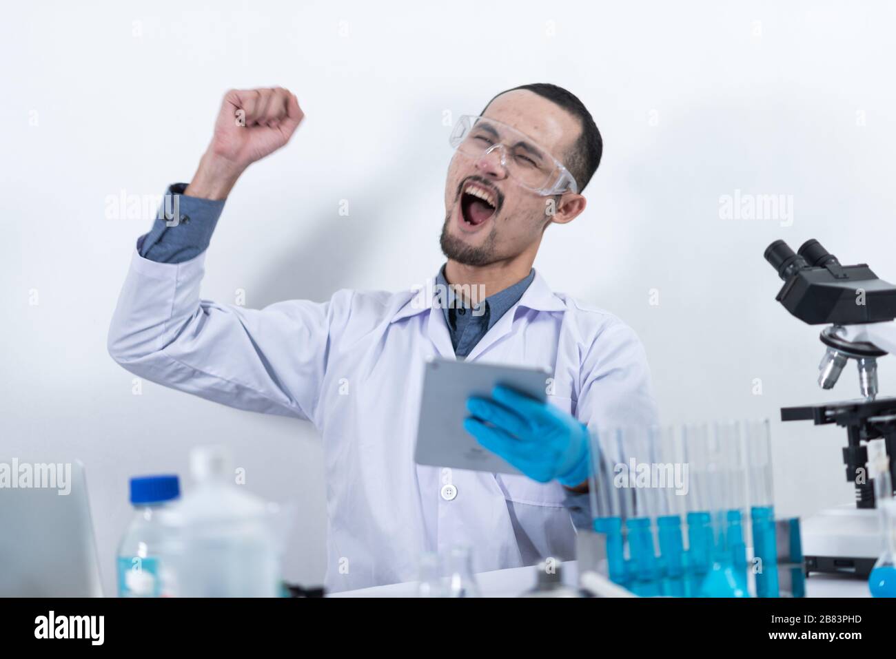 Scientists are working with digital tablet in laboratory Stock Photo