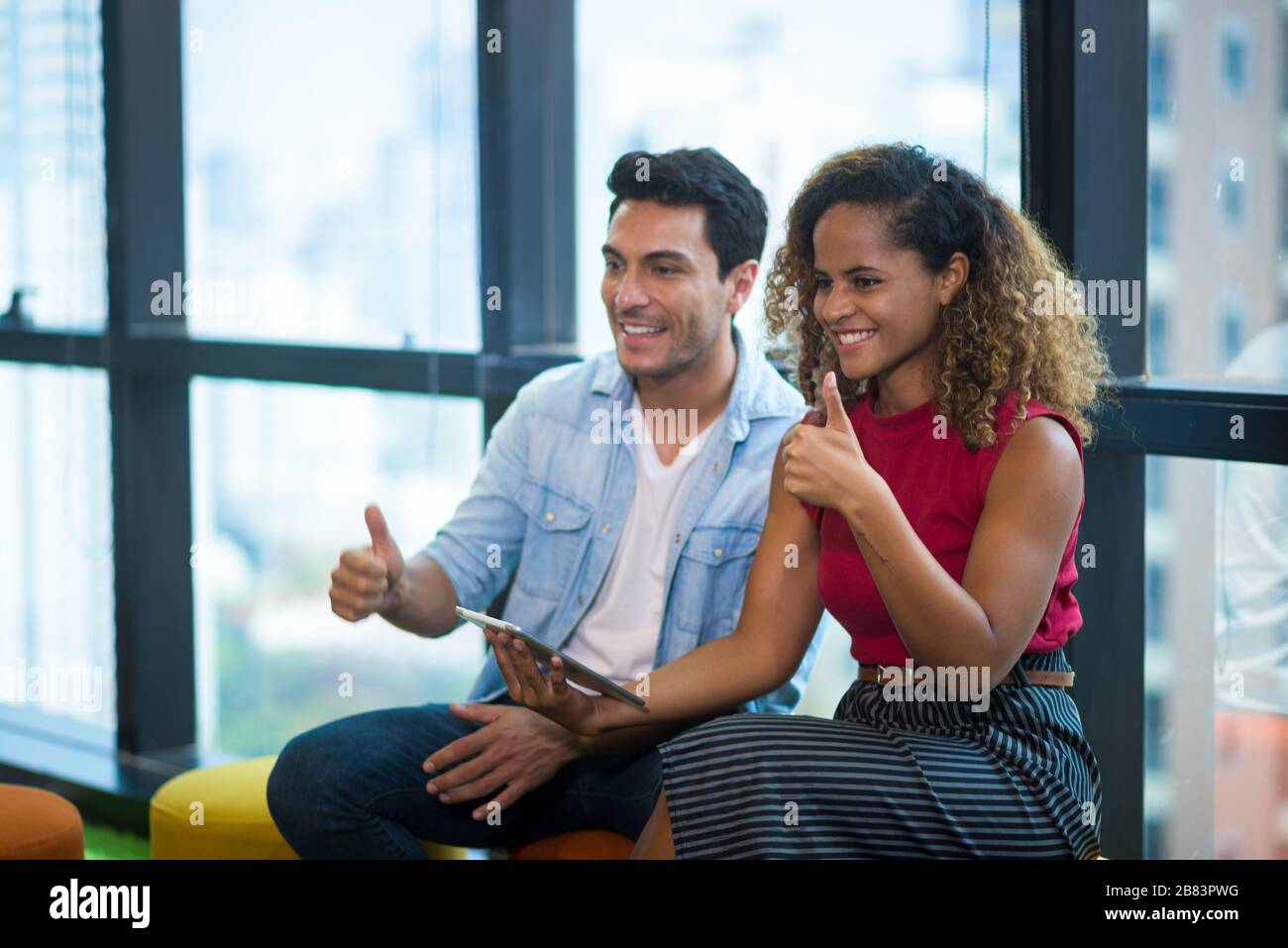 success and winning concept - happy business team celebrating victory in office Stock Photo