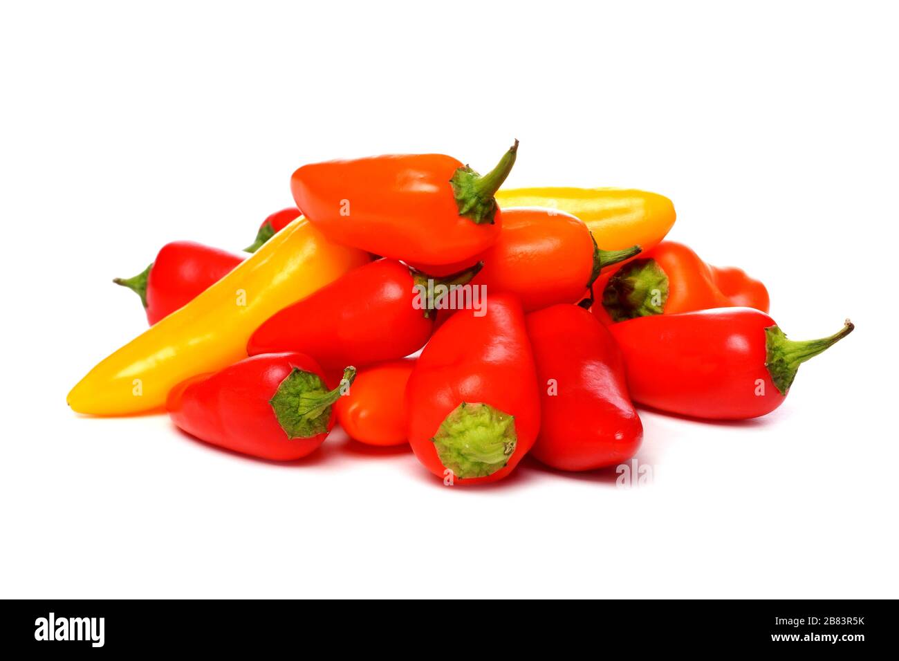 Pile of mini sweet peppers, yellow, red and orange isolated on a white background Stock Photo